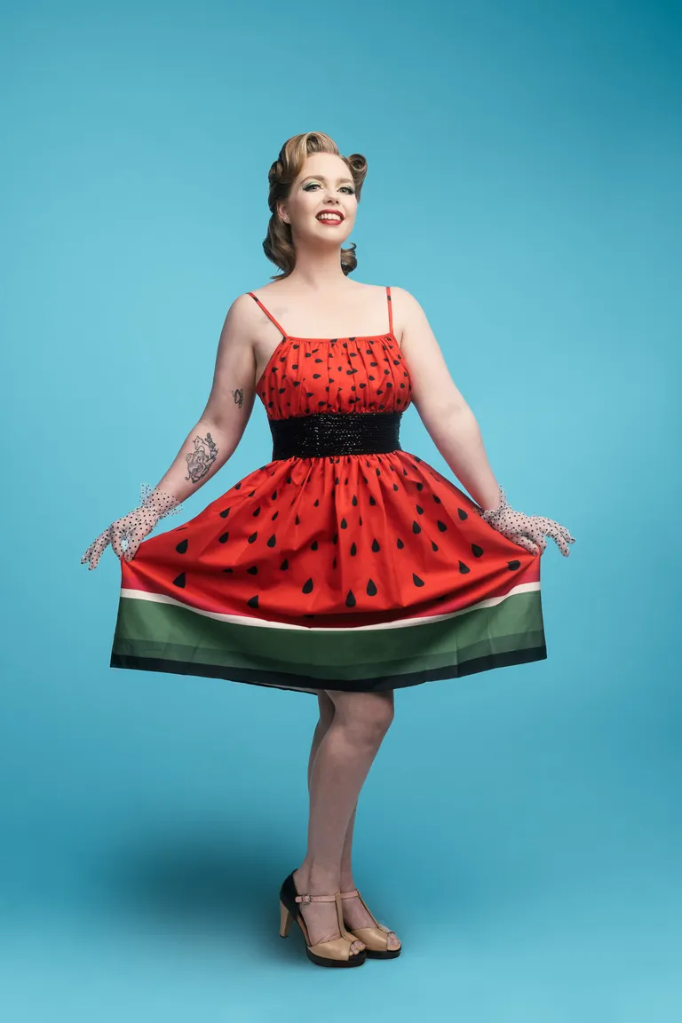 Blondie Sprinkles in a watermelon dress